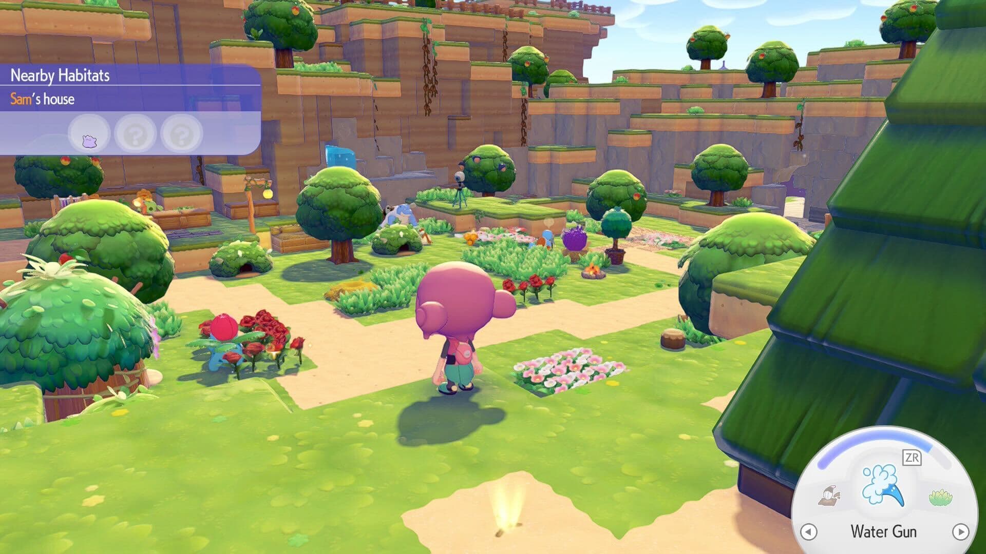 Charmander sleeping by a campfire in Pokemon Pokopia